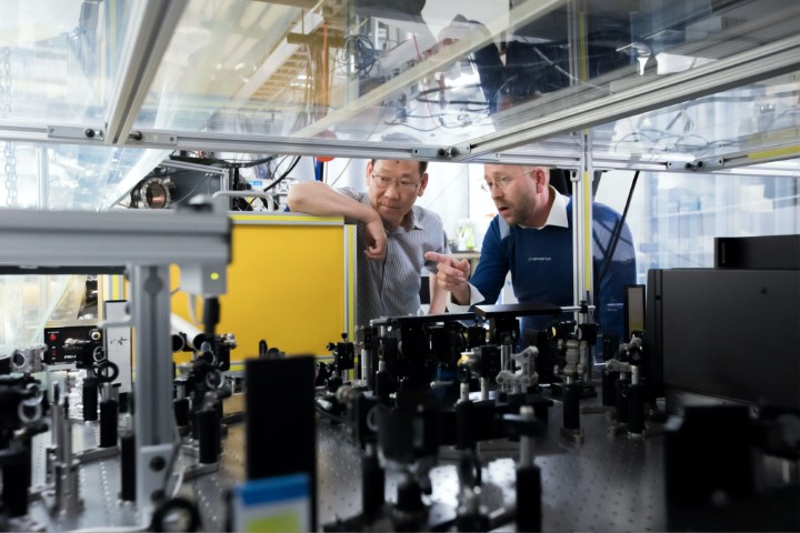 Men researching tyre integrity